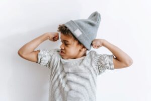 kid flexing biceps value of resilience in kids